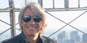 Singer Bon Jovi helps a woman